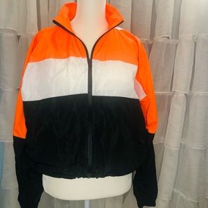 Reflective panelled wind breaker